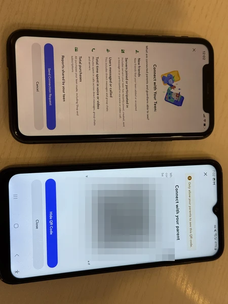 Parent scanning the Discord Family Center QR code